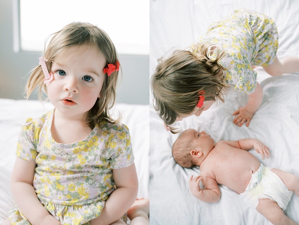 Toddler and baby laying on white bedding by Portland Newborn Photographer Emilie Phillipson Photography